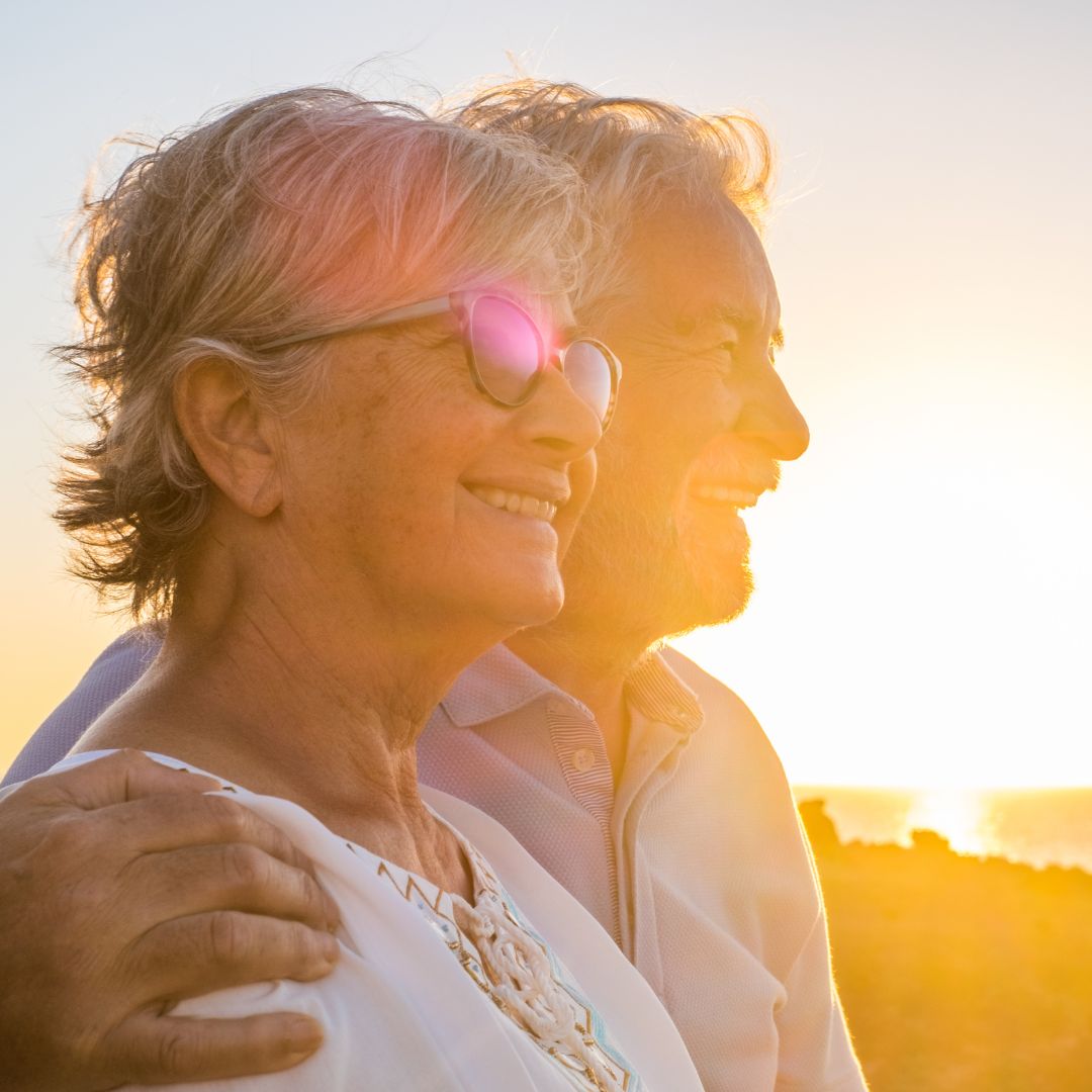 Elderly Couple looking at sunset